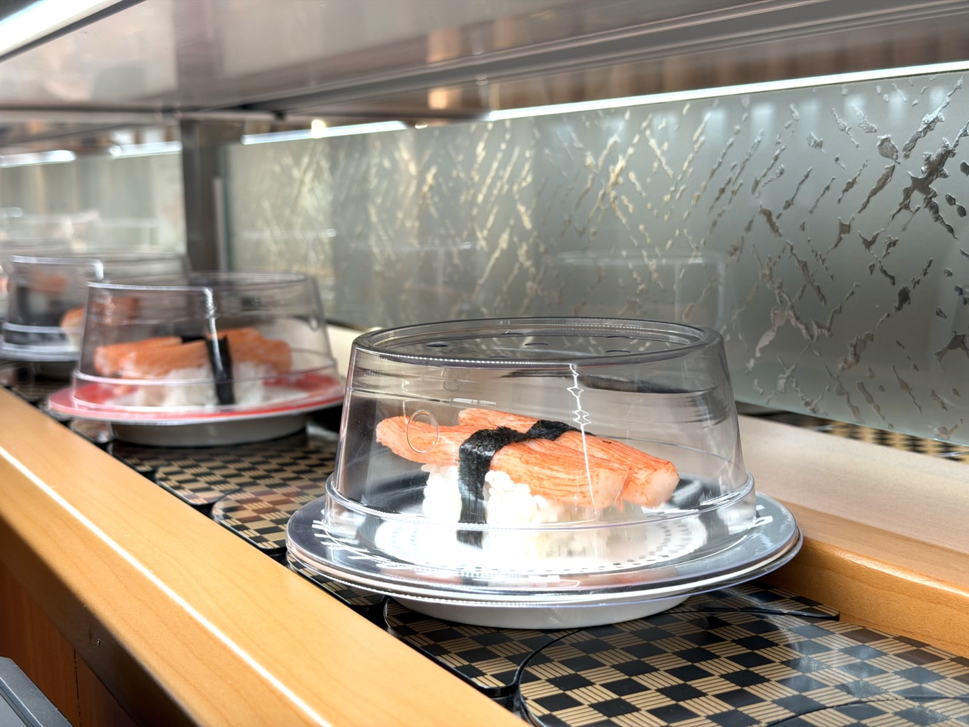 Makoto sushi menu Staten Island — fresh nigiri on conveyor belt