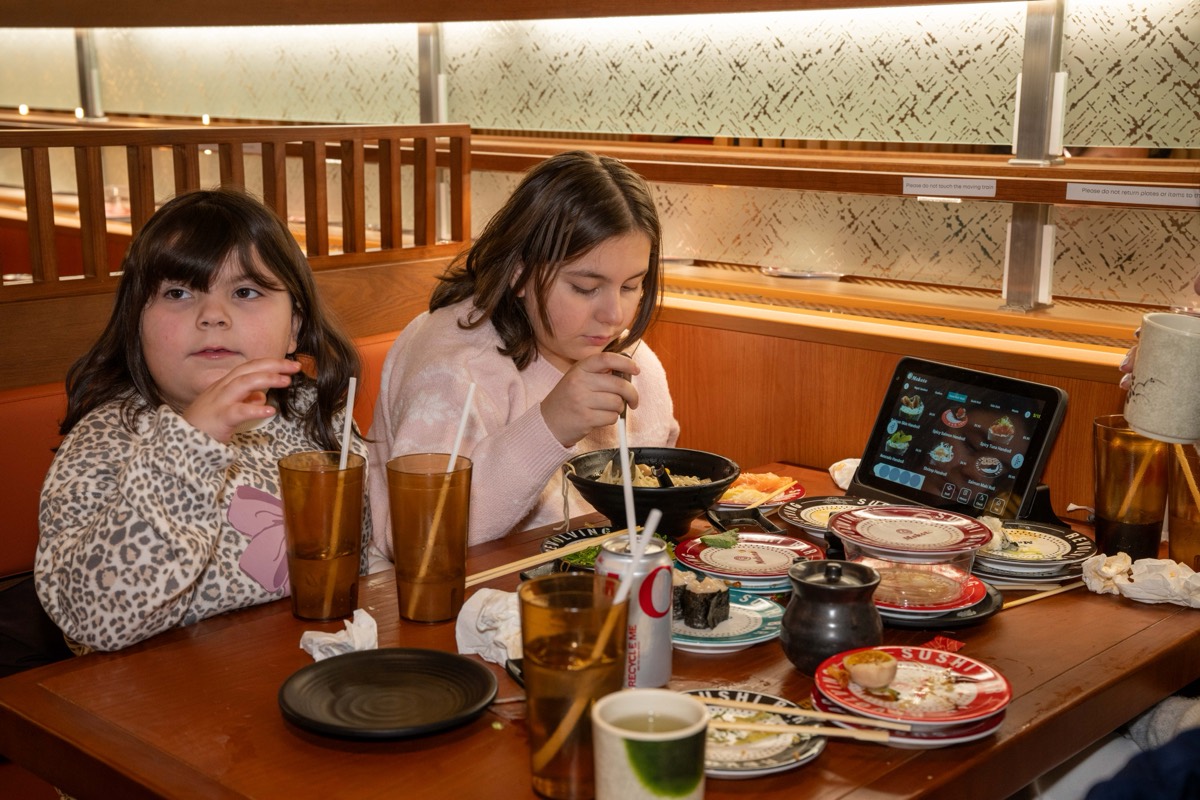 Sisters Olivia, 6, and Josephine, 10, Cuozzo dine at Makoto Revolving Sushi in New Dorp, Staten Island