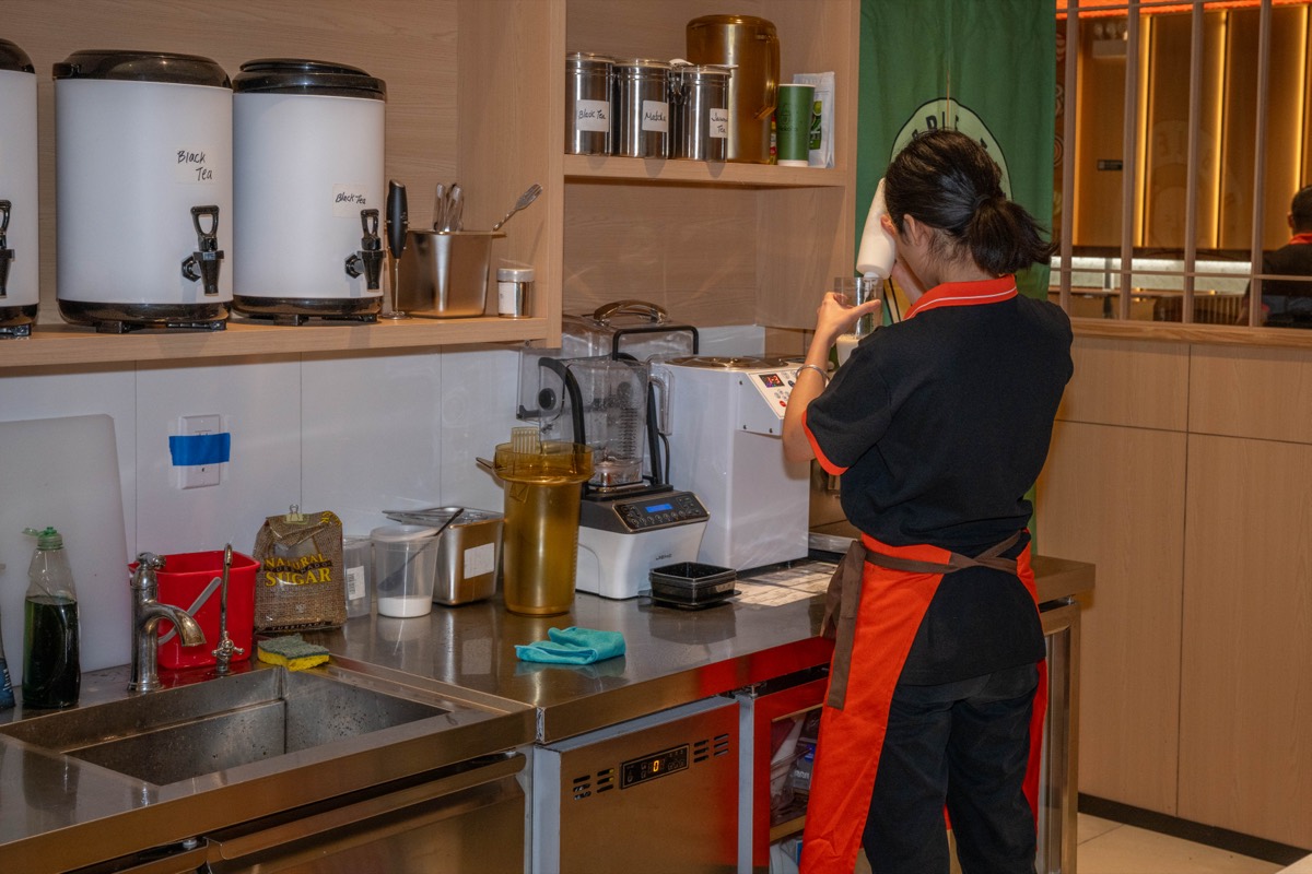 Emily L prepares bubble tea at Makoto Revolving Sushi Bar and Bubble Tea in New Dorp, Staten Island