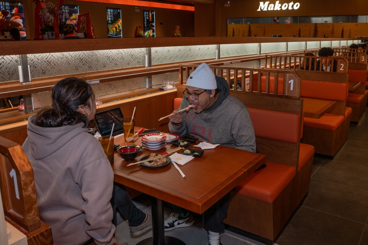 Eric Gapud and his daughter Ellie, 11, dine at Makoto Revolving Sushi in New Dorp, Staten Island
